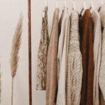 Sustainable clothing rack with neutral outfits for best sustainable fashion brands