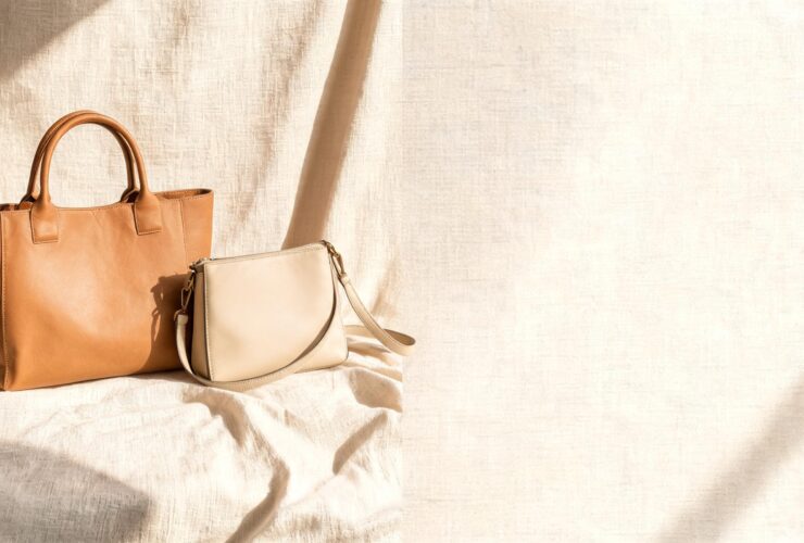 Elegant pre owned designer bags displayed on a neutral background in a soft luxury setting.