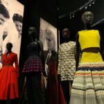 Fashion exhibition with mannequins wearing colorful designer outfits for fashion trends.