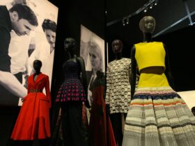 Fashion exhibition with mannequins wearing colorful designer outfits for fashion trends.