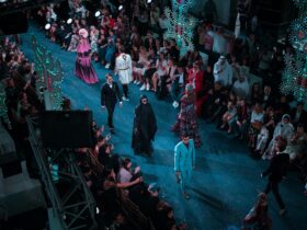 Fashion runway show with models and audience at New York Fashion Week.