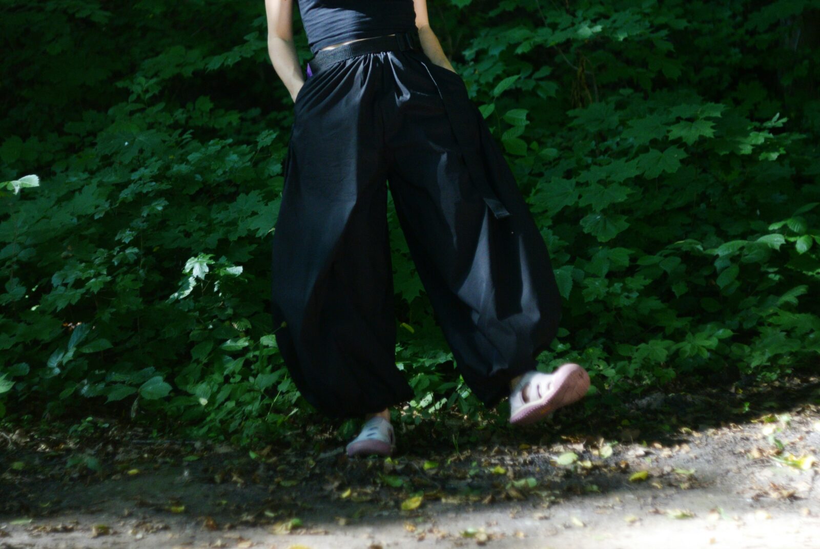 Woman wearing a fitted tucked top with tailored wide leg pants