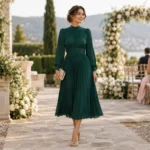 Long sleeve modest wedding guest dress in an elegant midi length